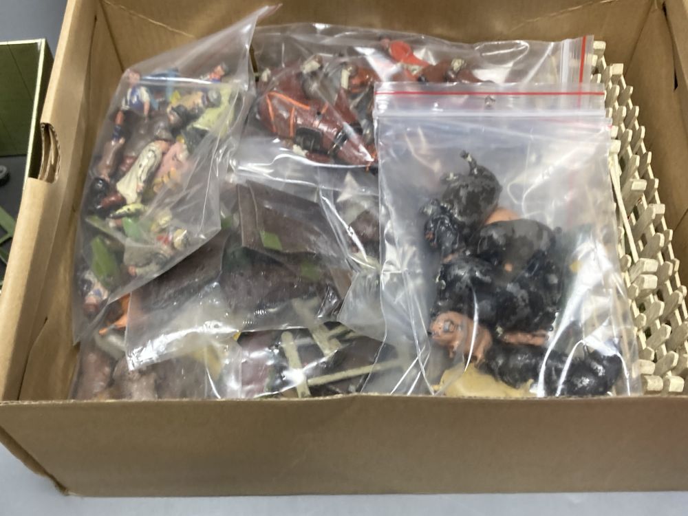 A collection of Britains painted lead farm figures and animals,